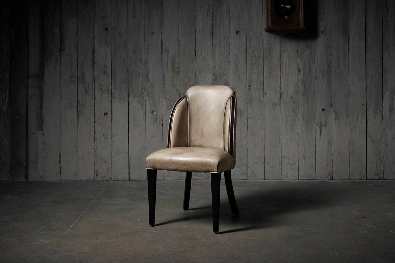 Deco Diner Art Deco inspired authentic leather dining chair with geometric curves and wraparound banding