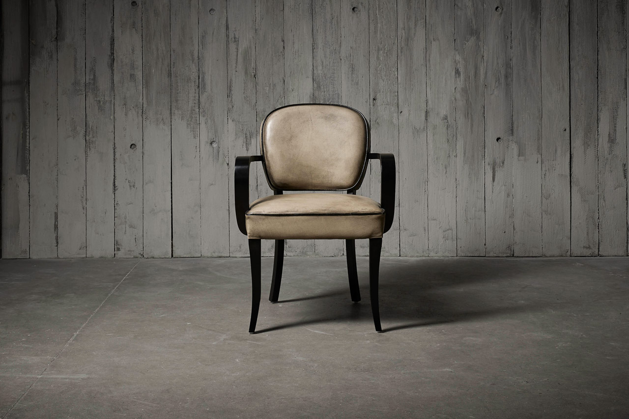 Bridge leather dining chair featuring a beautifully curvaceous supportive design