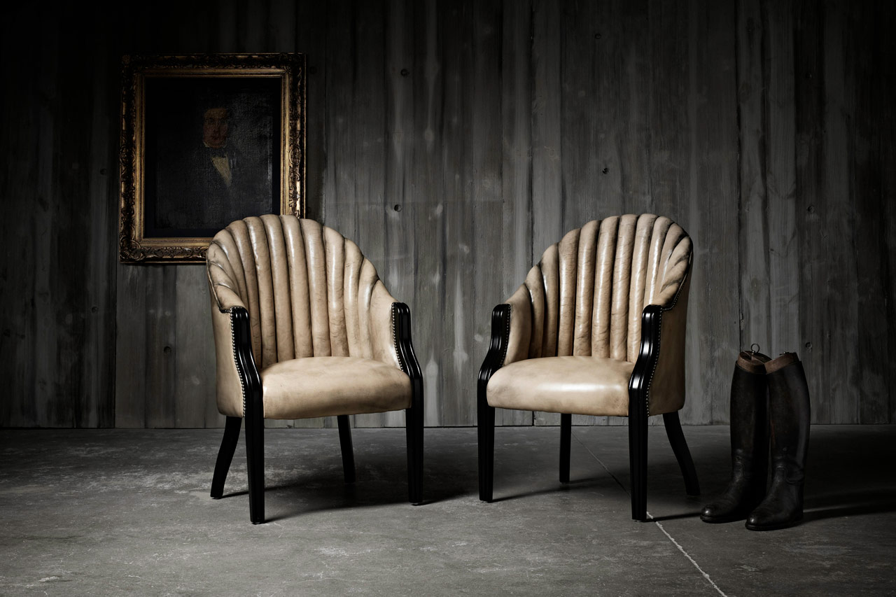 Belvedere full grain leather dining chair with barrel shaped fluted back and scalloped side profile