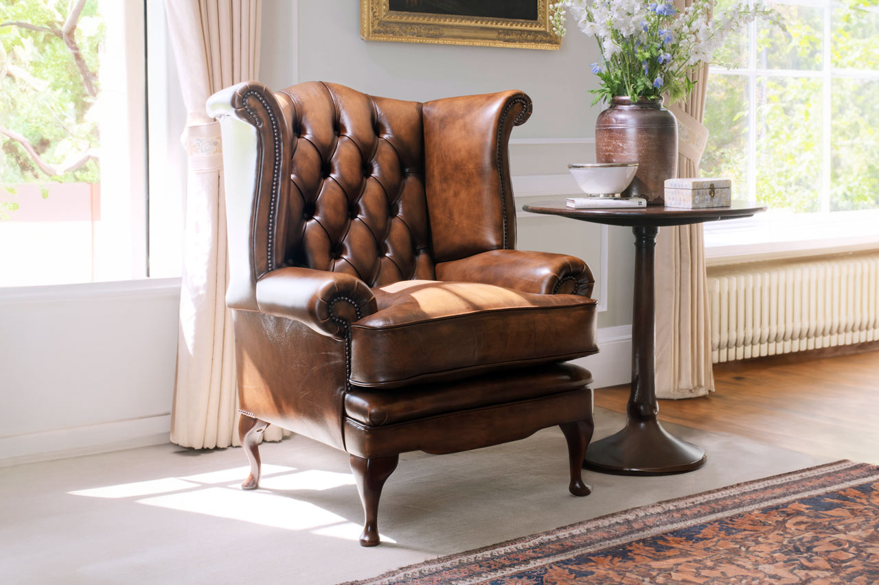 Edward wingback high end leather chair with soft silhouette defined by voluptuous form
