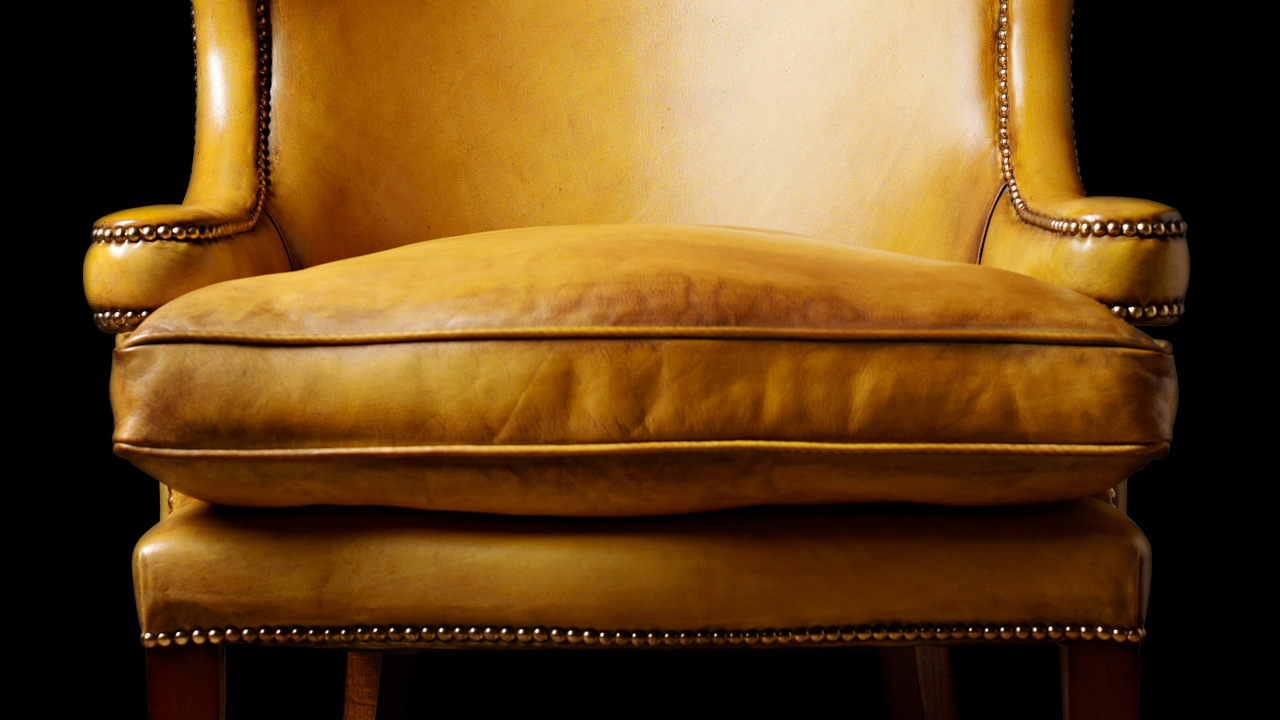 Jonathan Swift Sillón orejero amarillo