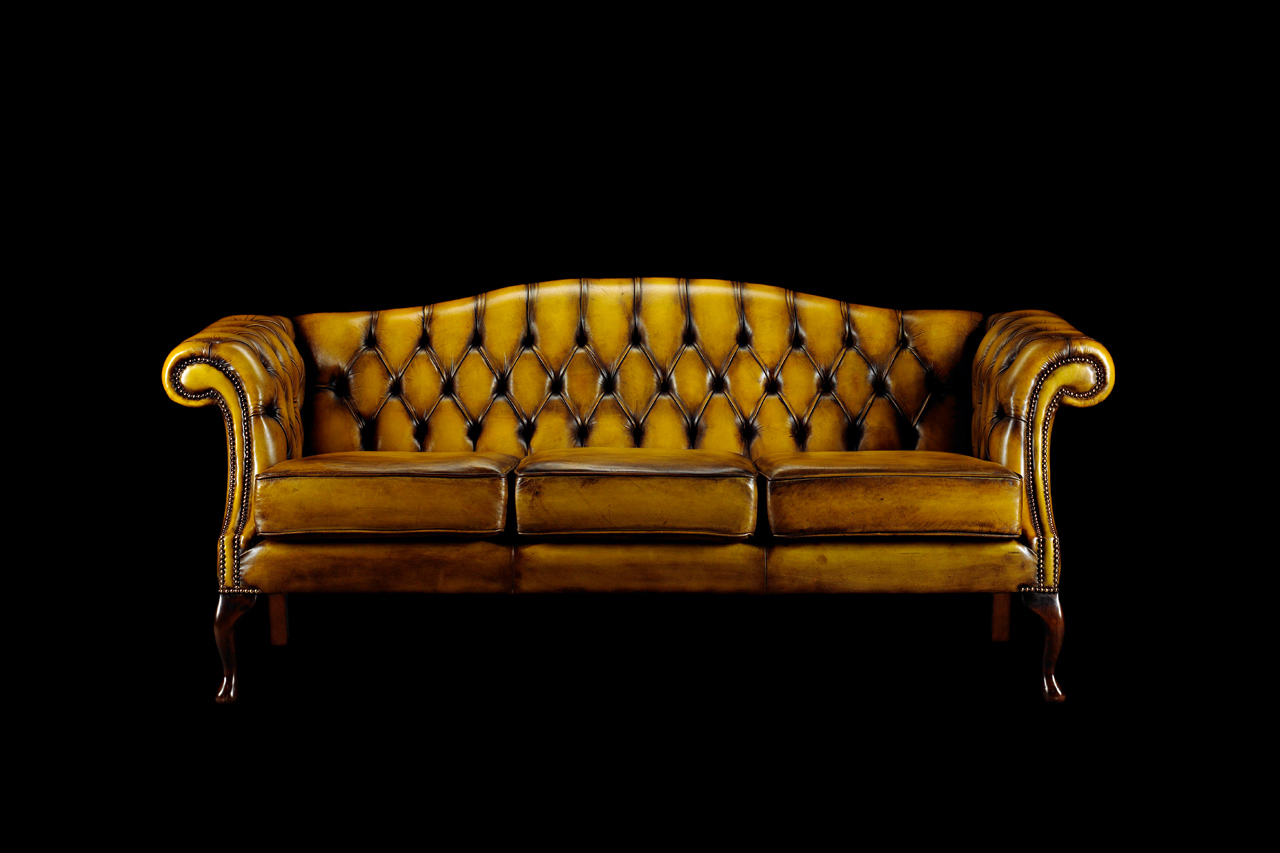 Yellow tufted leather sofa